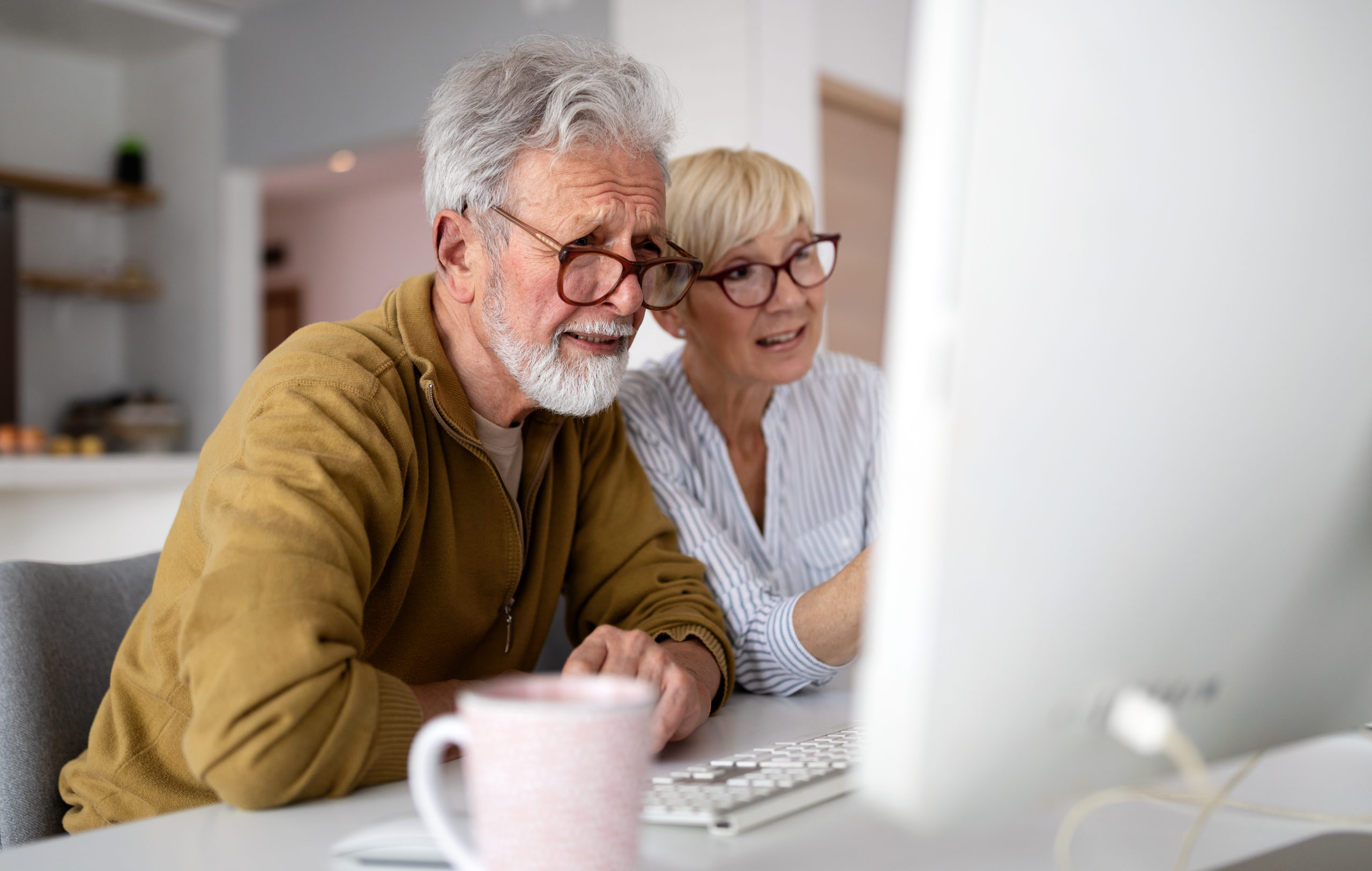 Senior couple looking at facebook ad